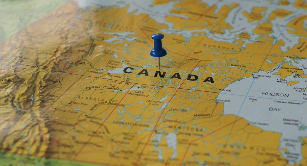 Yellow map of Canada with a blue pin marking a location.